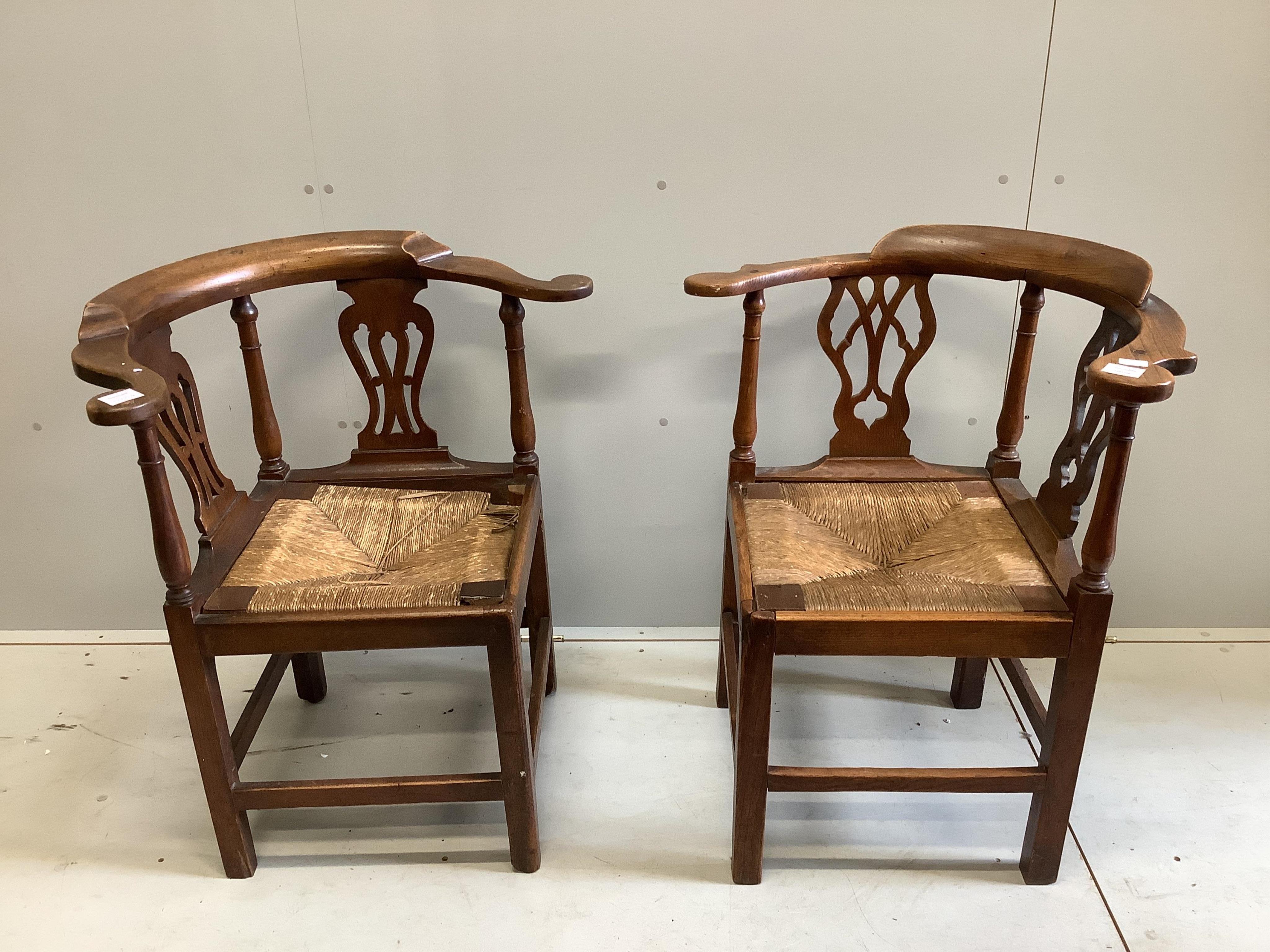 Two George III corner elbow chairs, one oak, one mahogany, larger width 76cm, depth 64cm, height 85cm. Condition - poor to fair